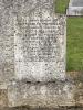Short granite gravestone with rounded top with shoulders