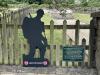 Woodchester Wayside Cross WW1 memorial left hand fence with plaque and silent soldier