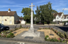 Memorial cross set within a square memorial garden