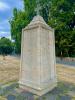Large tapered plinth with cross on capstone