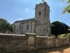 Location of Windrush Parishioners WW1 stone memorial in outer wall of St Peter's Church Windrush