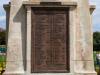 Cast bronze plaque with raised lettering.