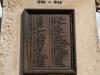 Cast bronze plaque with raised lettering.