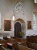 Madingley war memorial in-situ adjacent to the left of the door
