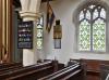 Main WWI wall plaque in context at centre to the right of the organ