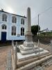 Appledore obelisk and kneeling soldier silhouette next to St Mary's Church Appledore