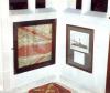 Framed remnants on the White Ensign (sent by the crew of HMS Black Prince to Knowle Sunday School), and adjacent framed photo of the ship with handwritten card.