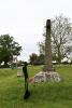 Side view of Peterstow cross with silhouette of WW1 soldier