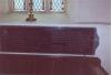 Wooden panelling set below a window 