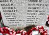 Inscription on west side (obscured by wreaths)