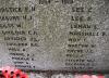 Inscription on north side (obscured by wreaths)
