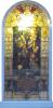 Stained-glass window with colourful biblical scene and ornamented border