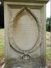 Close up of the inscription panel contained within oval shaped wreath