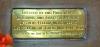 A view of the small brass plaque containing the dedication and set into the base of the main memorial