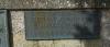 Bronze plaque on the memorial base with the name of a Falklands Casualty St Mary's Church Bridport Dorset