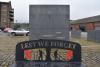 Main feature including 'Lest We Forget' bench