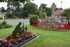 Rear view garden of remembrance including 'Lest We Forget' soldier and memorial