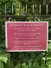 Plaque on the church railings behind the Cross