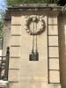 Wreath on pillar at end of wall