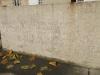 One face of the base of the Sedgeford Memorial obelisk, with slightly worn inscribed names, ranks, and units.