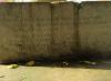 One face of the base of the Sedgeford Memorial obelisk, with slightly worn inscribed names, ranks, and units.