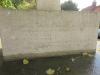 One face of the base of the Sedgeford Memorial obelisk, with slightly worn inscribed names, ranks, and units.
