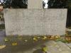 One face of the base of the Sedgeford Memorial obelisk, with slightly worn inscribed names, ranks, and units.