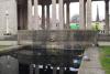 The WW2 dates inscribed on the end parapet of each pool in the garden - and showing one of the cast iron lamp stands around the Monument