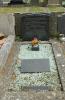 The marker in front of the family headstone