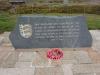 A grey slate memorial with inscription