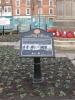 Descriptive plaque next to memorial 