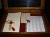 Showing open cabinet which contaisn the roll of honour 