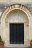 Relief around doorway that includes WW1 Tablets on either side