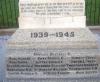 Lower inscriptions on plinth (6 o'clock face)