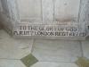 Close up of part of the inscription at the bottom of a stone baptismal basin.
