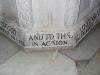Close up of part of the inscription at the bottom of a stone baptismal basin.