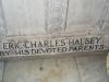 Close up of part of the inscription at the bottom of a stone baptismal basin.