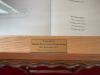 Plaque on the display case lid